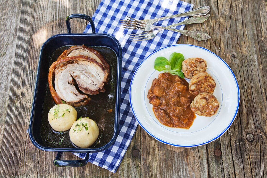 Pretzel dumplings with sauerkraut, goulash, roast pork and potato dumplings