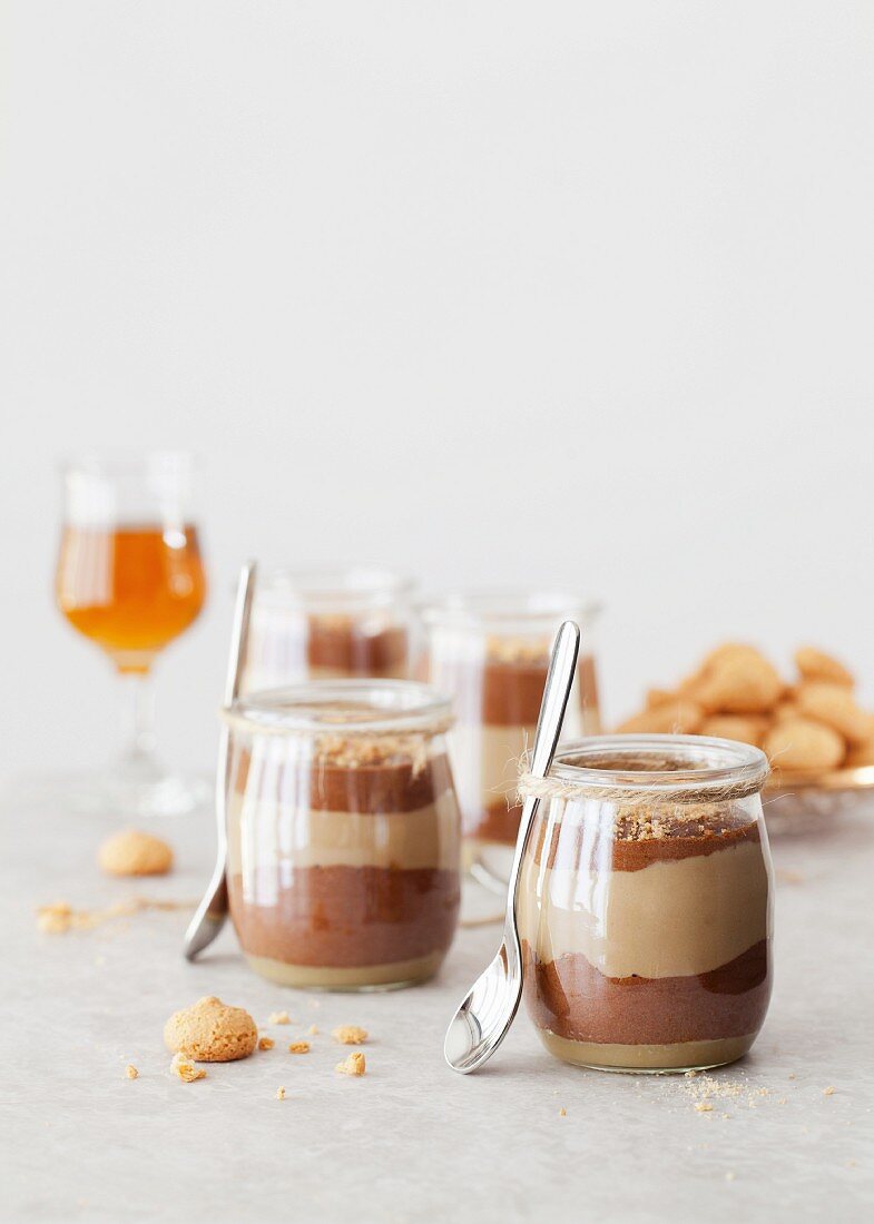 Layer dessert with coffee and chocolate cream in glasses