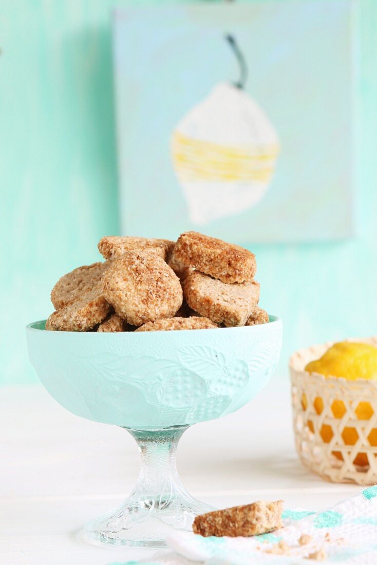 Gluten-free cookies with buckwheat flour and coconut blossom sugar, with lemons in a basket