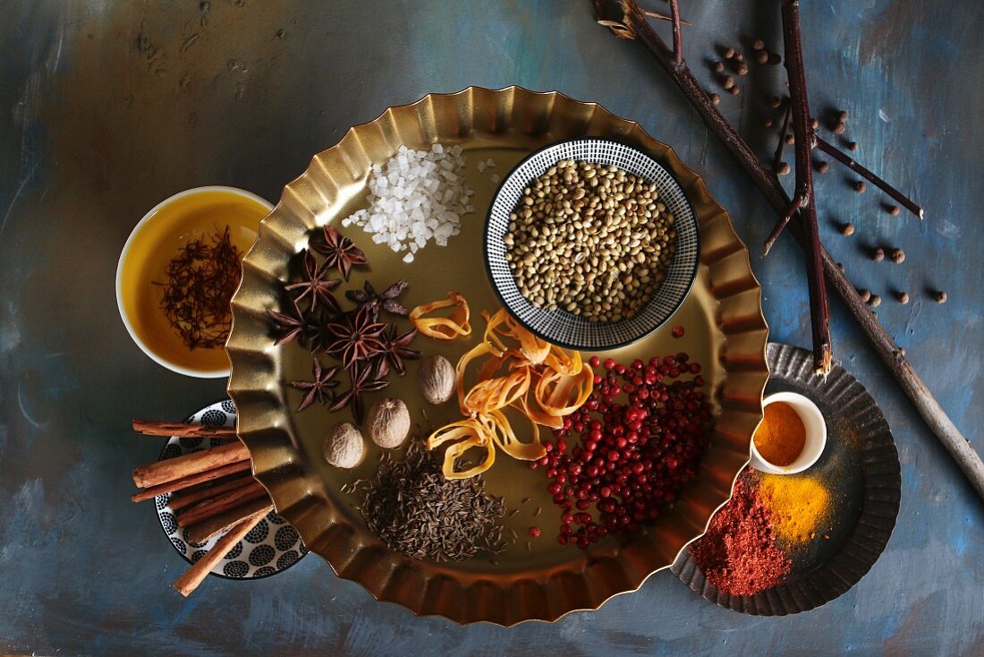 Bowls of spices on a blue background