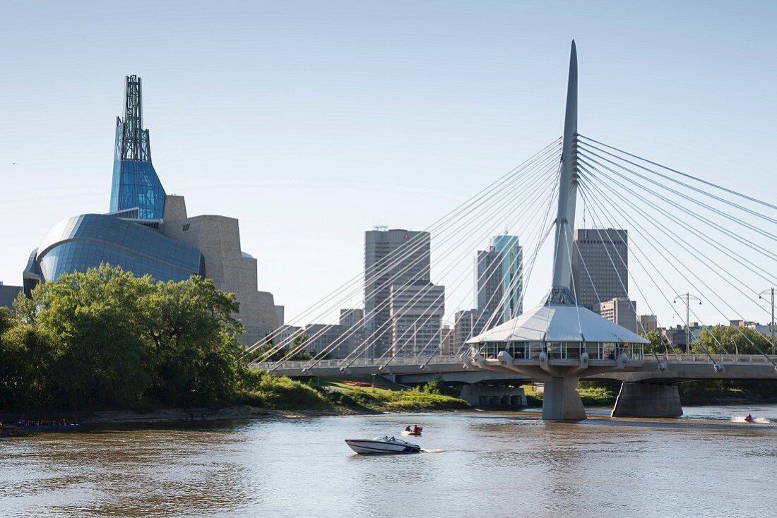 The Red River and the Esplanade Bridge with the Canadian Museum for Human Rights on the left and the skyline of Winnipeg, Province of Manitoba, Canada