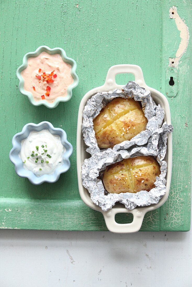 Potatoes in foil with two dips