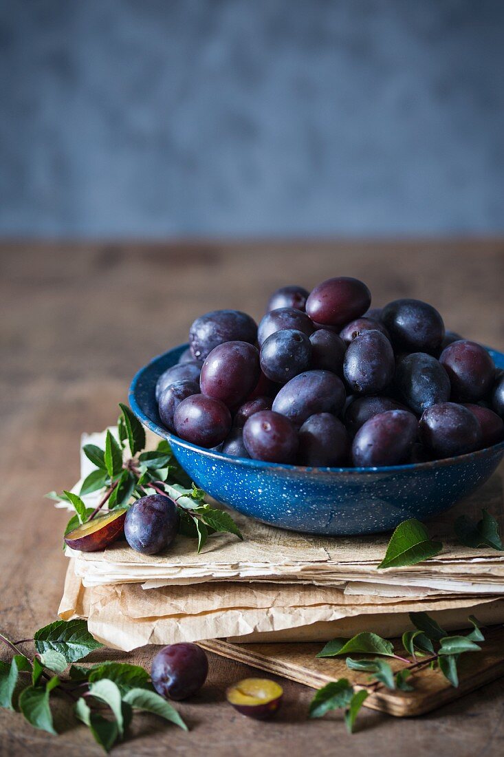 Freshly picked plums in a bowl