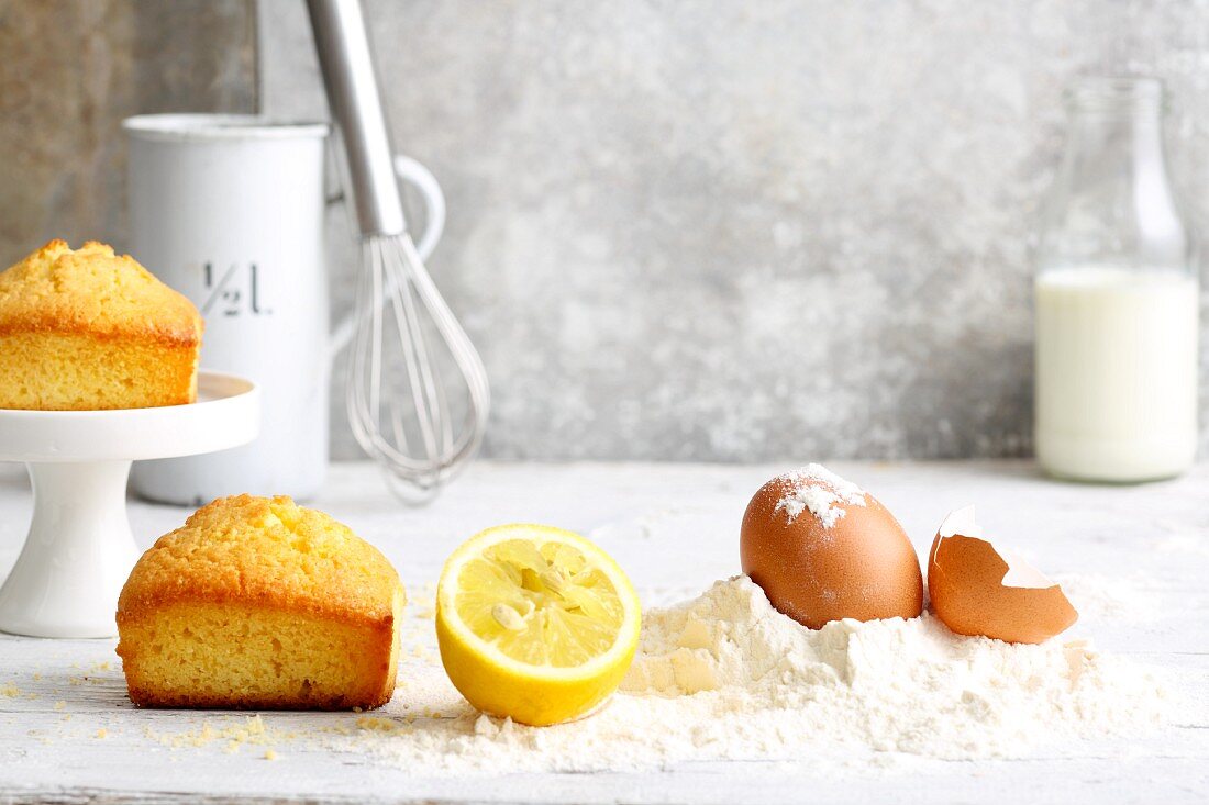 An arrangement of mini cakes and baking ingredients