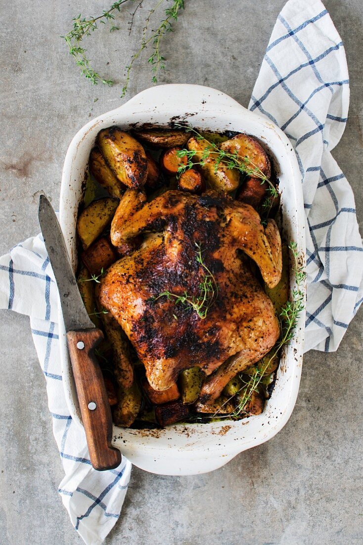 Roast chicken with potatoes and thyme