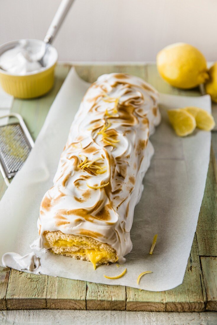 Swiss roll with lemon curd and meringue topping