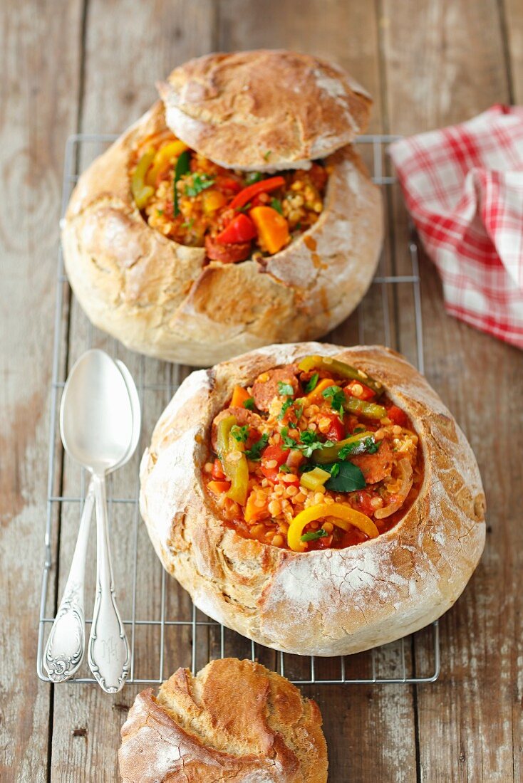 Chorizo, lentils and vegetables gulash in bread