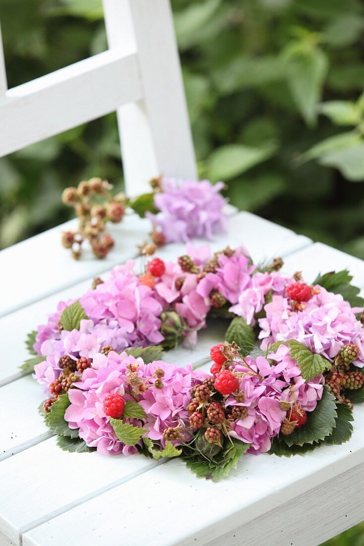 Luxuriant wreath of hydrangeas, berries and leaves