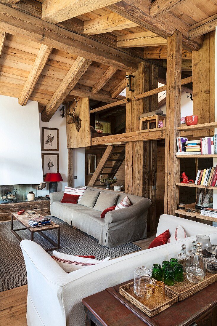 Living area with rustic gallery in chalet