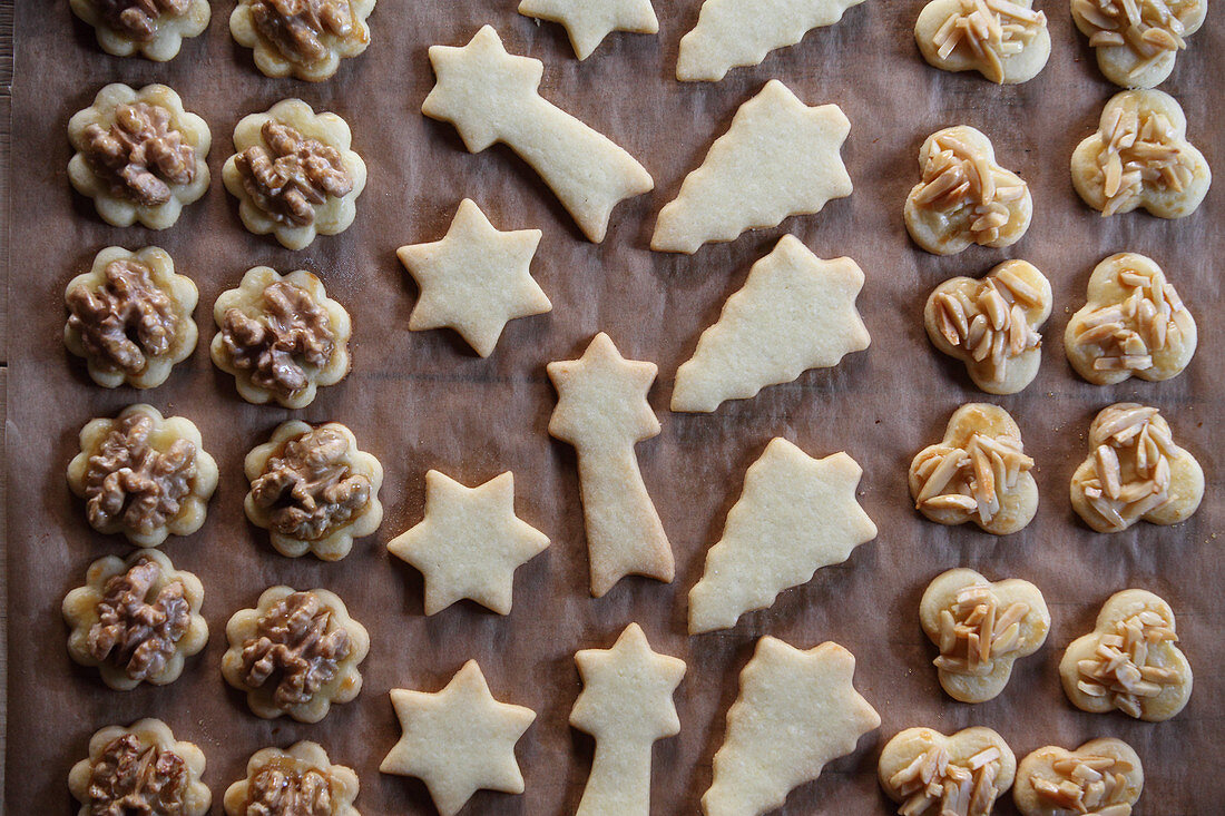 Butter cookies with walnuts and almonds on baking paper
