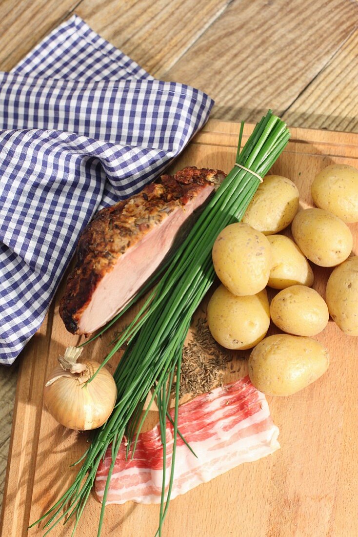 Ingredients for 'Tiroler Gröstl' (Tyrolean roast meat and potatoes)