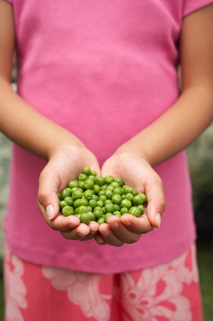 Girl Holding Peas