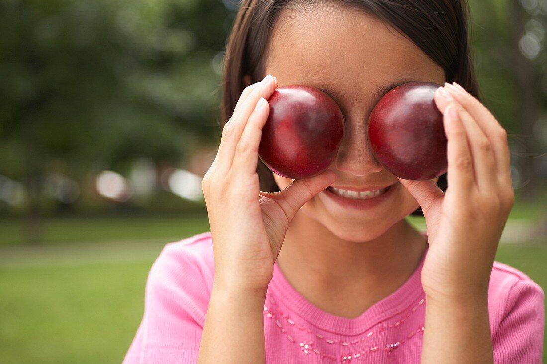 Girl Holding Plums