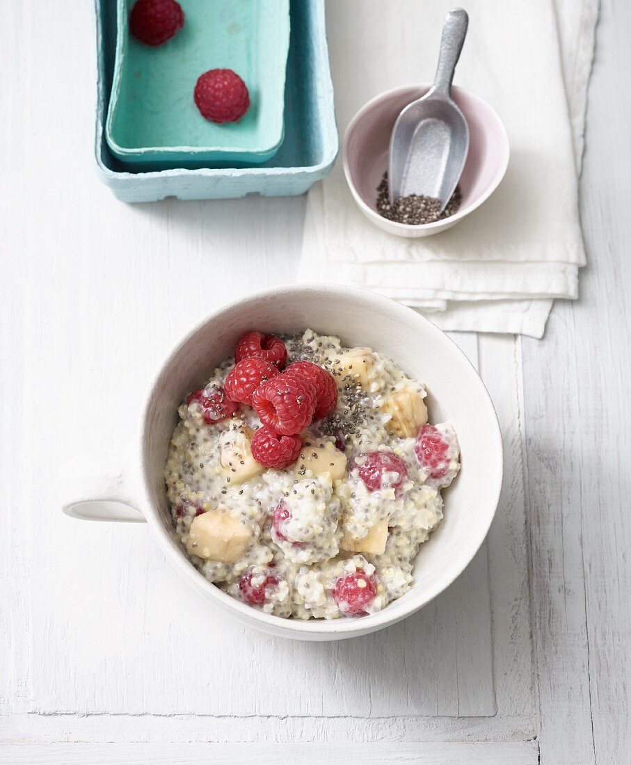 Millet and chia muesli with almond milk, raspberries and banana (lactose-free)
