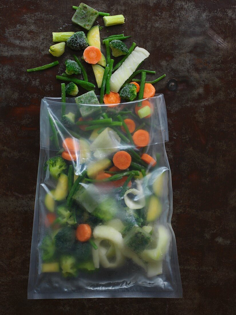 Frozen vegetables with herb and oil ice cubes