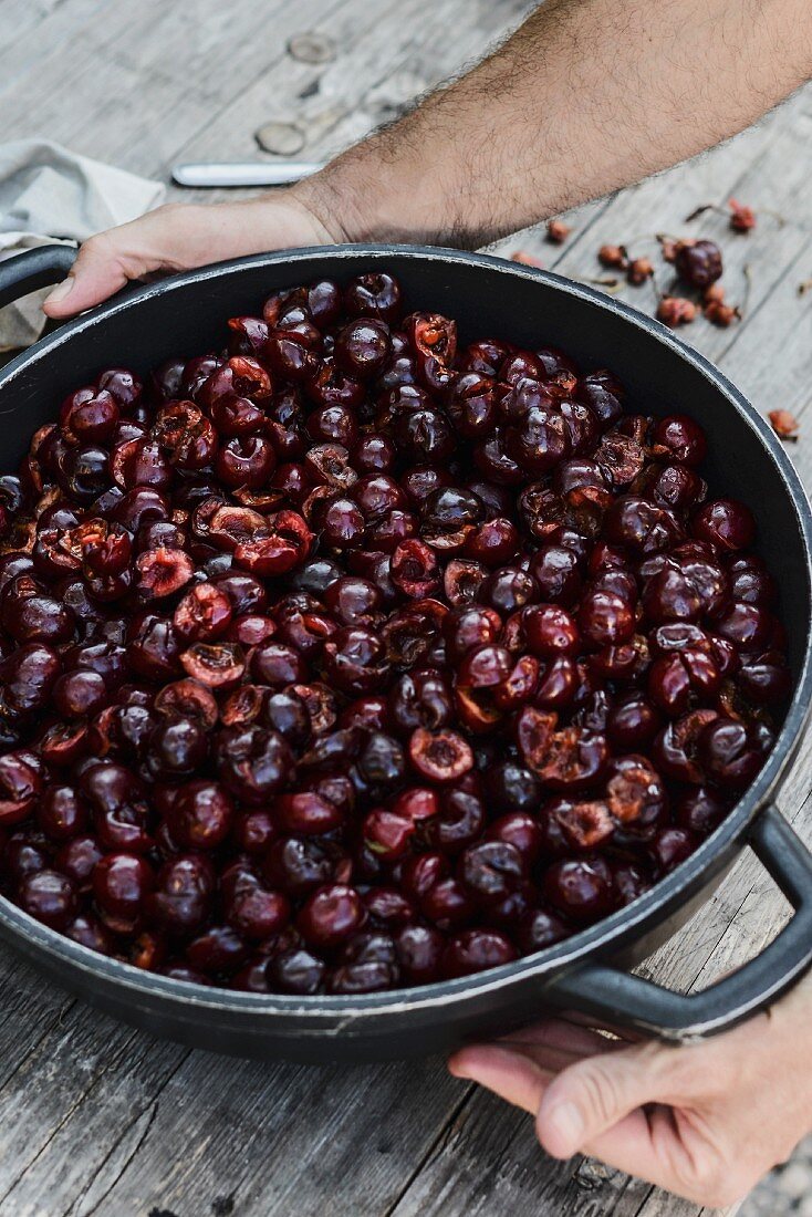 Stoned cherries in a metal dish