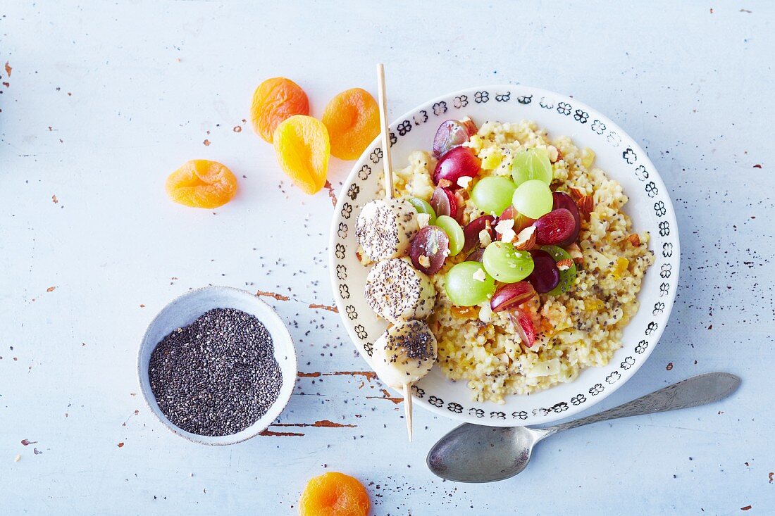 Vegan millet bowl with grapes and a banana skewer (soya-free)