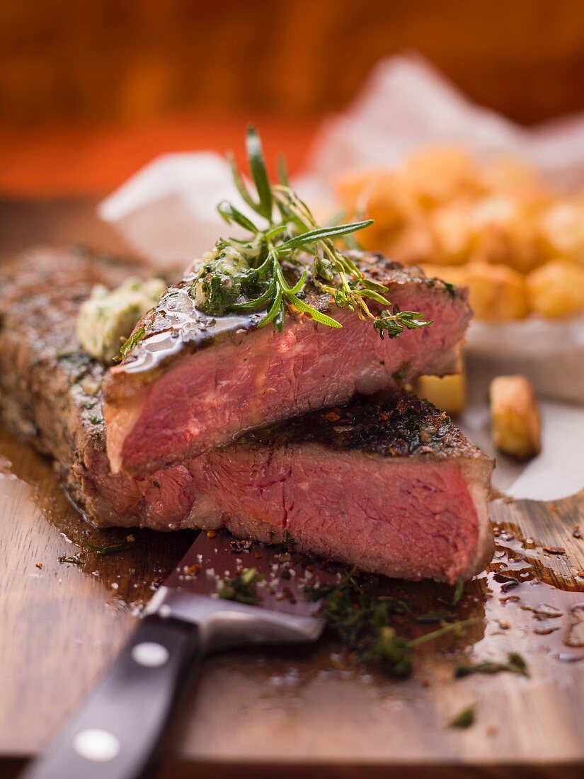 Beef steak with herb butter, partly sliced