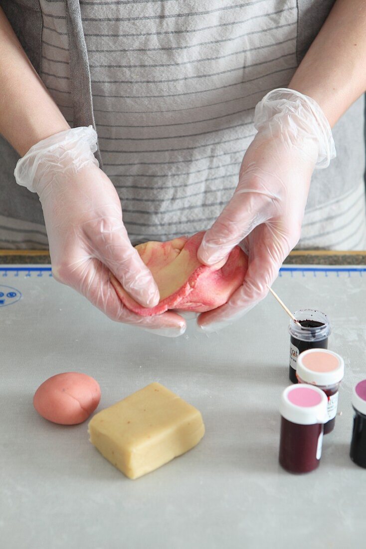 Marzipan being dyed with food colouring