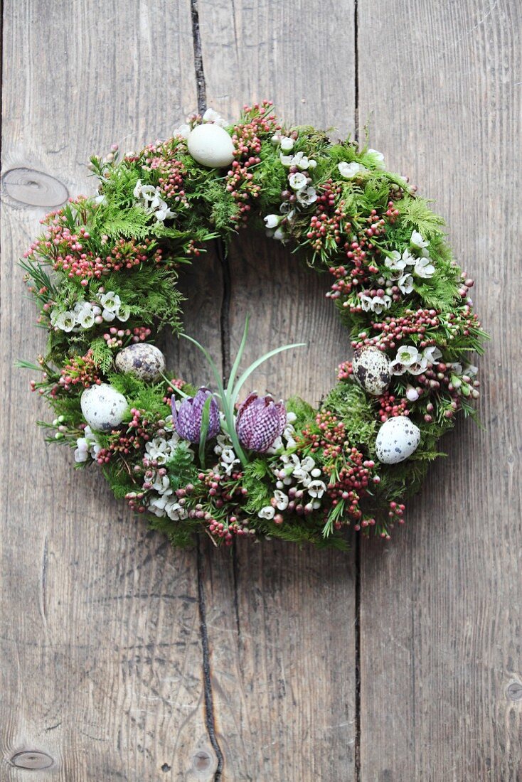 Romantic Easter wreath with quail eggs and snake's head fritillaries