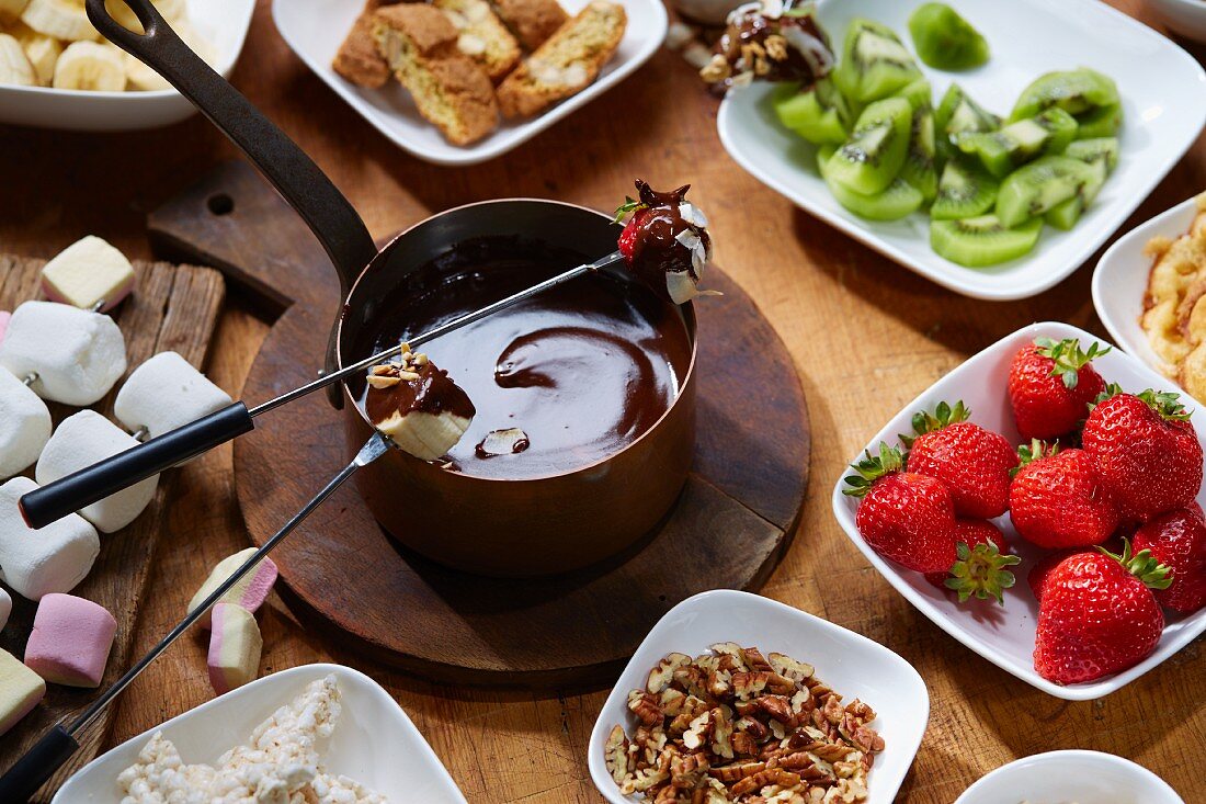 Chocolate fondue with fruit and marshmallows
