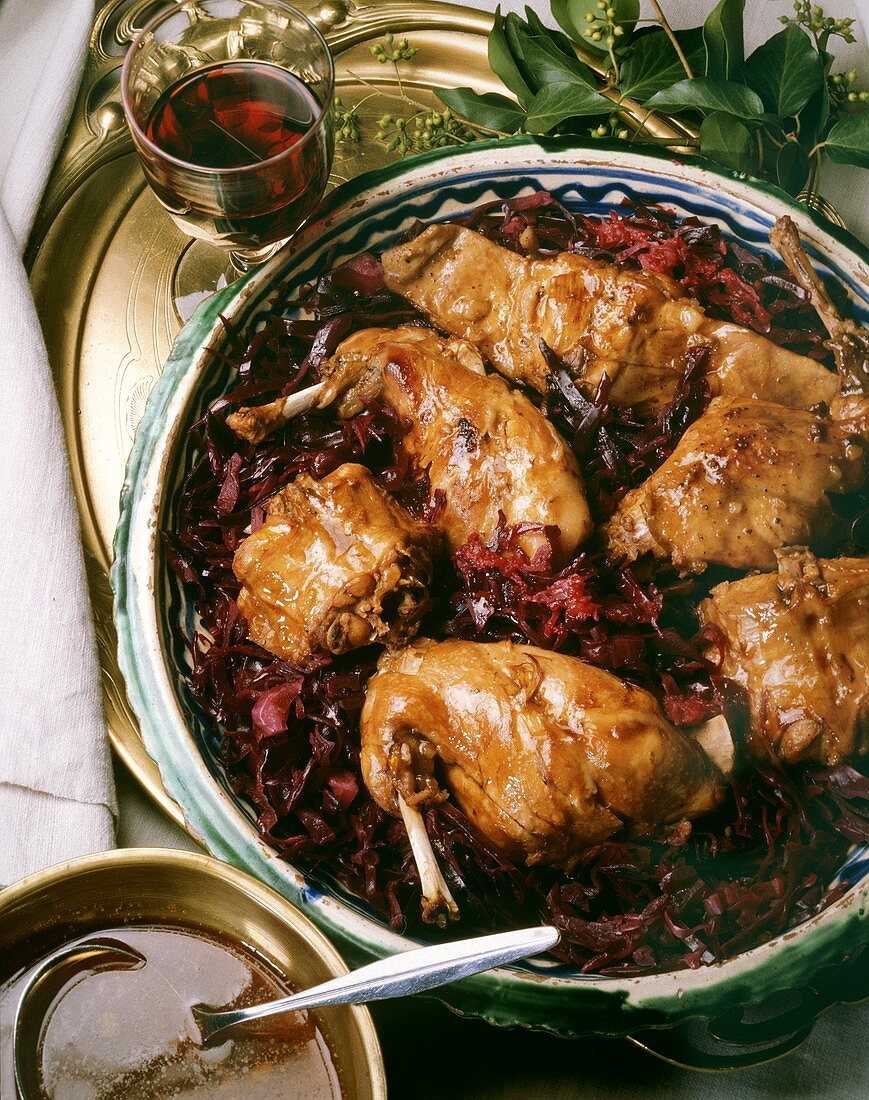 Baked rabbit pieces on red cabbage