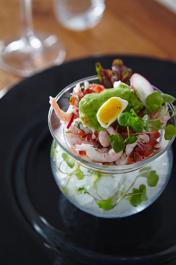 Shrimp salad with quail egg on ice