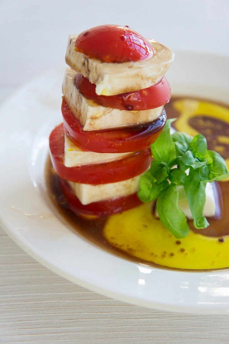 A stacked mozzarella and tomato salad