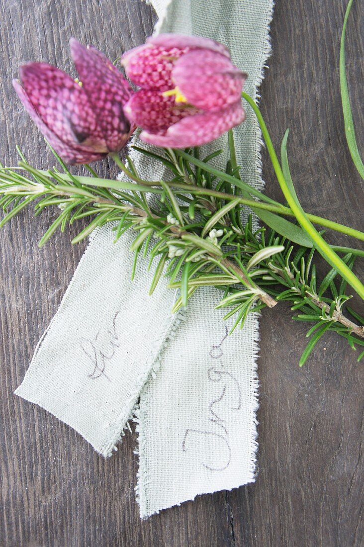 Rosemary sprig, name on ribbon and snake's head fritillary