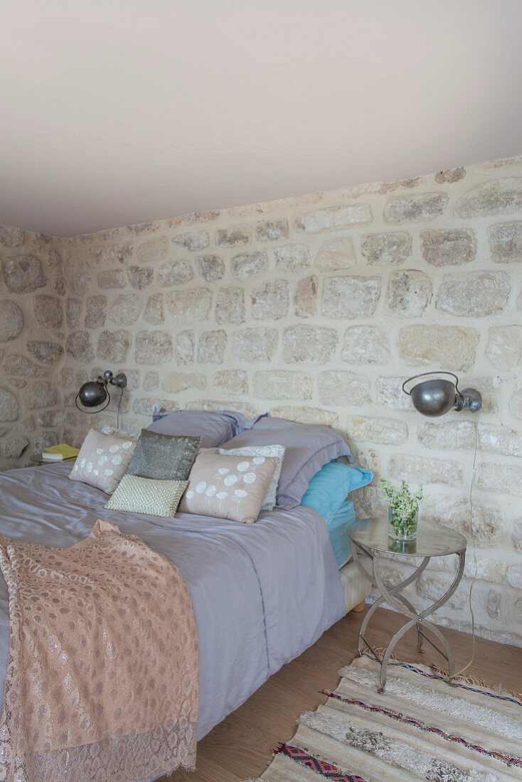 Oriental ambiance and stone walls in bedroom