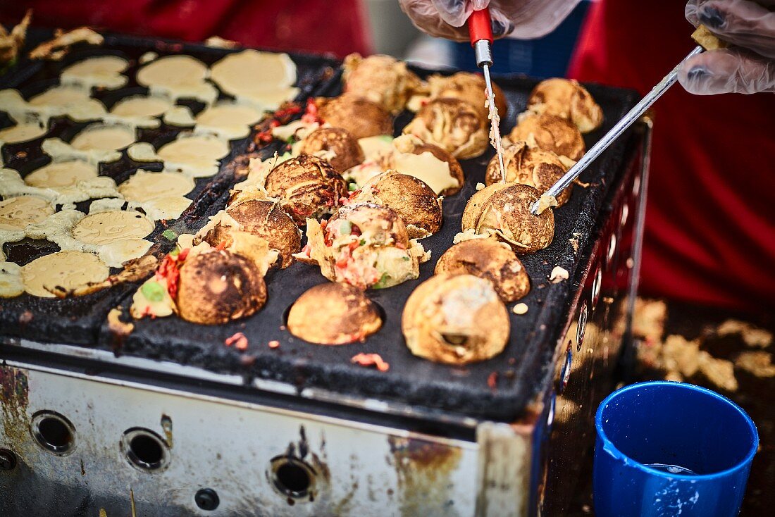 Stuffed Asian dough balls in a street kitchen