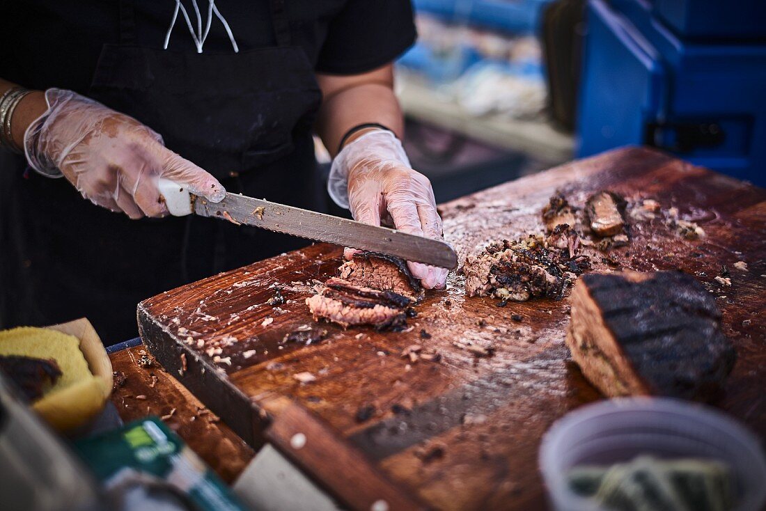 Grilled lamb sliced in a street kitchen