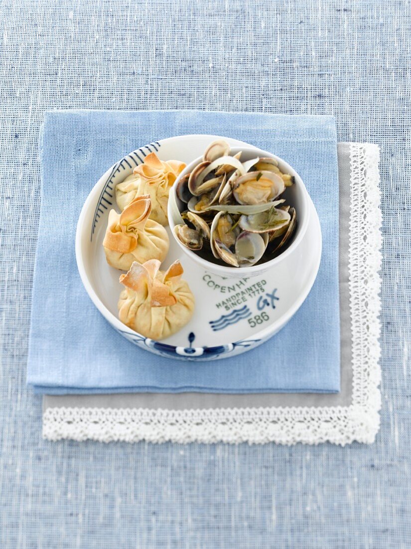 Clams with filled pastry parcels