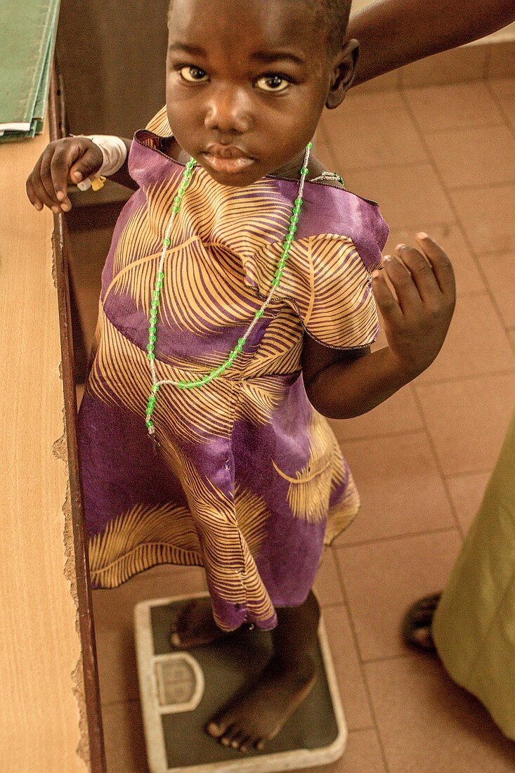 Girl being weighed