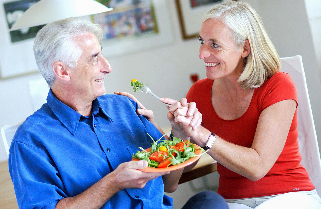 Senior couple eating a salad