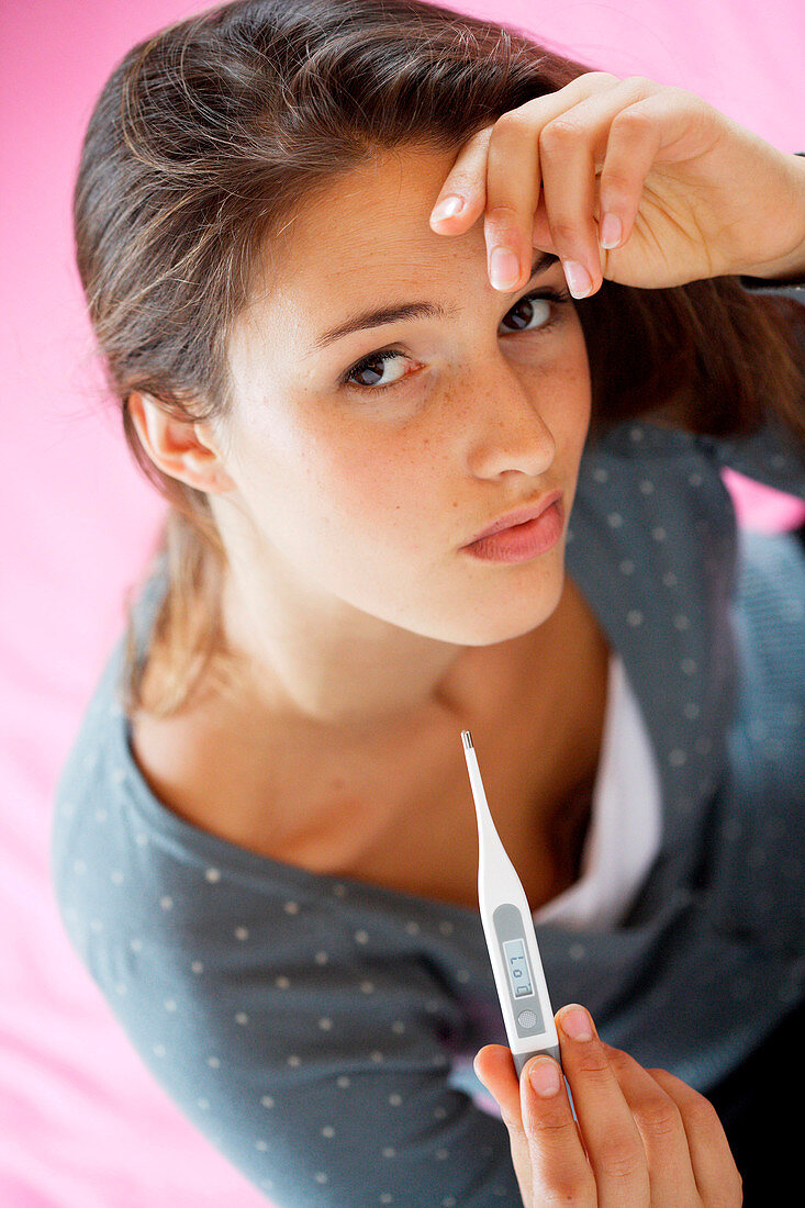 Woman checking her temperature