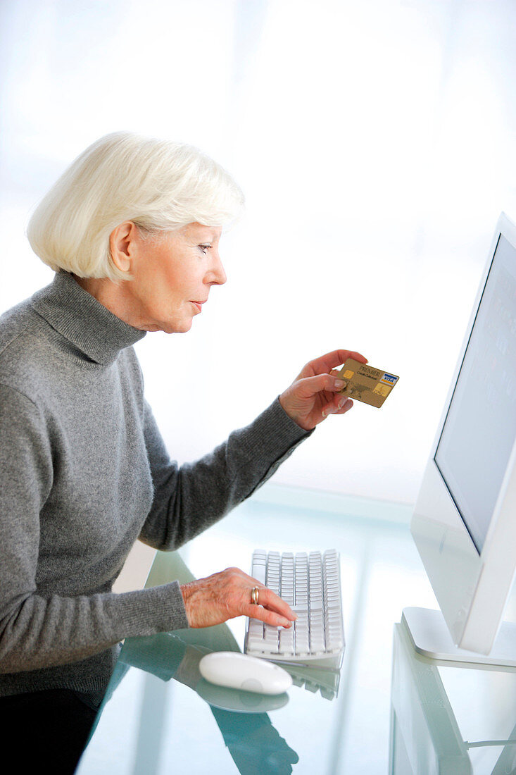 Senior woman making online purchase