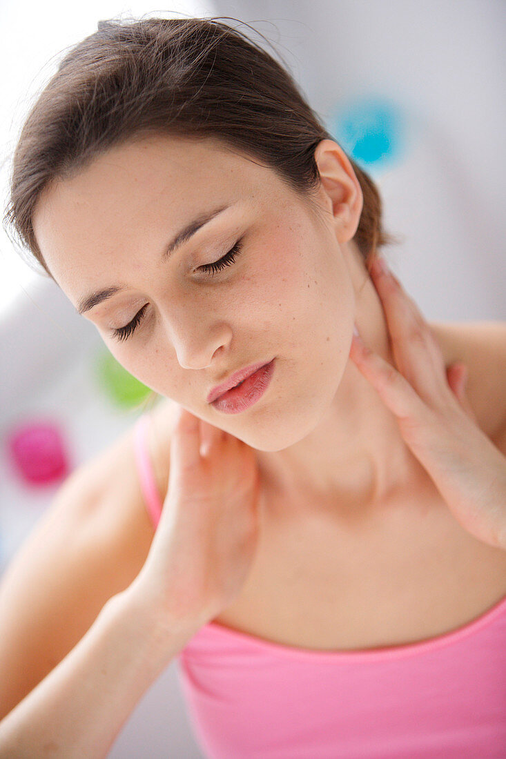 Woman suffering from neck pain