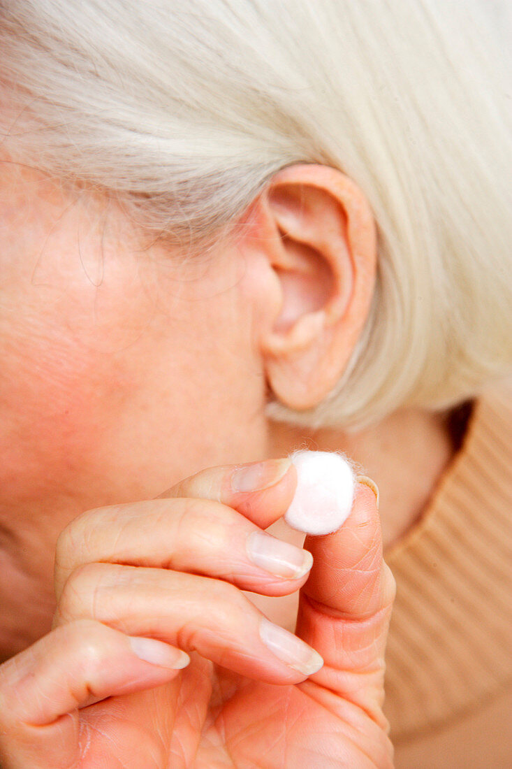 Woman with ear plugs