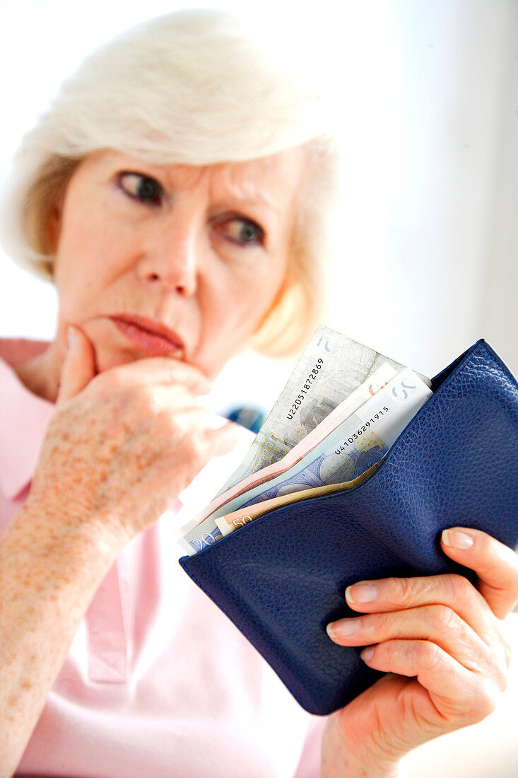 Elderly person counting money