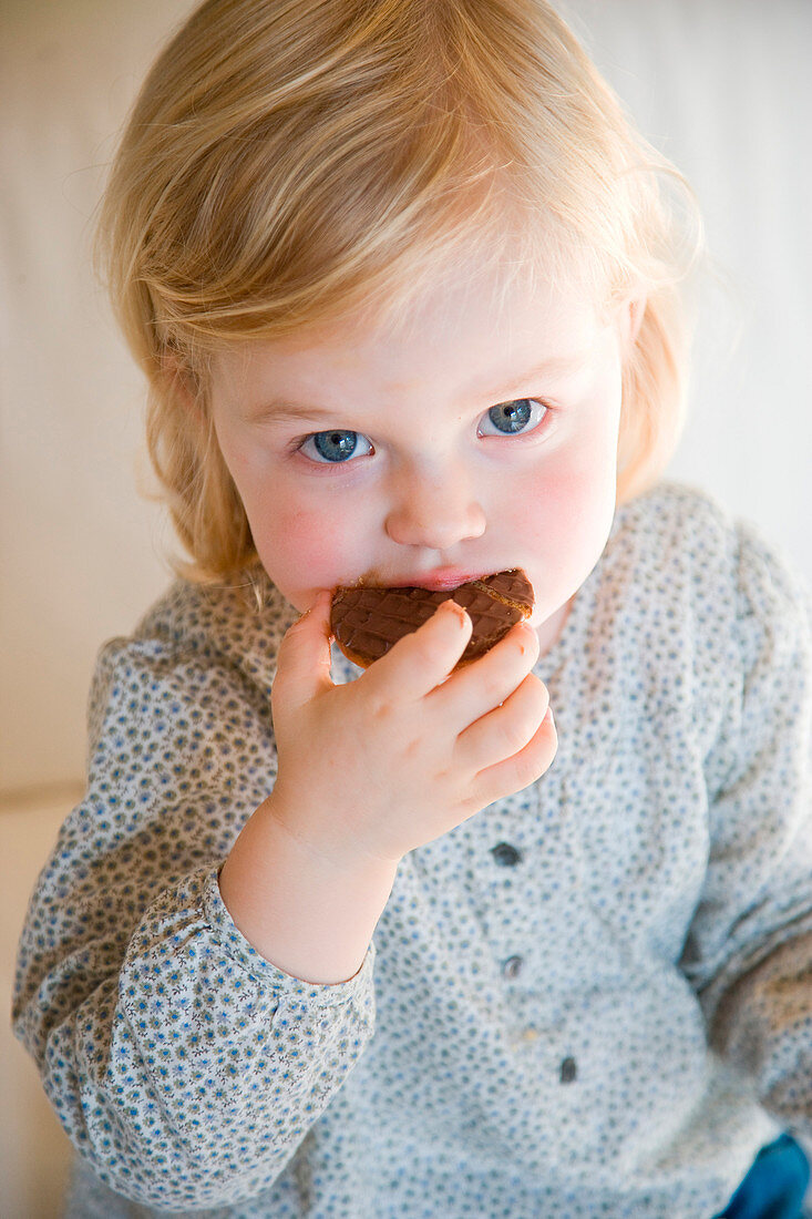 Child eating cookie