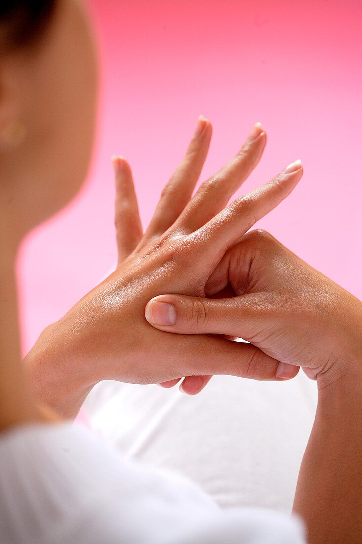 Woman massaging her hands