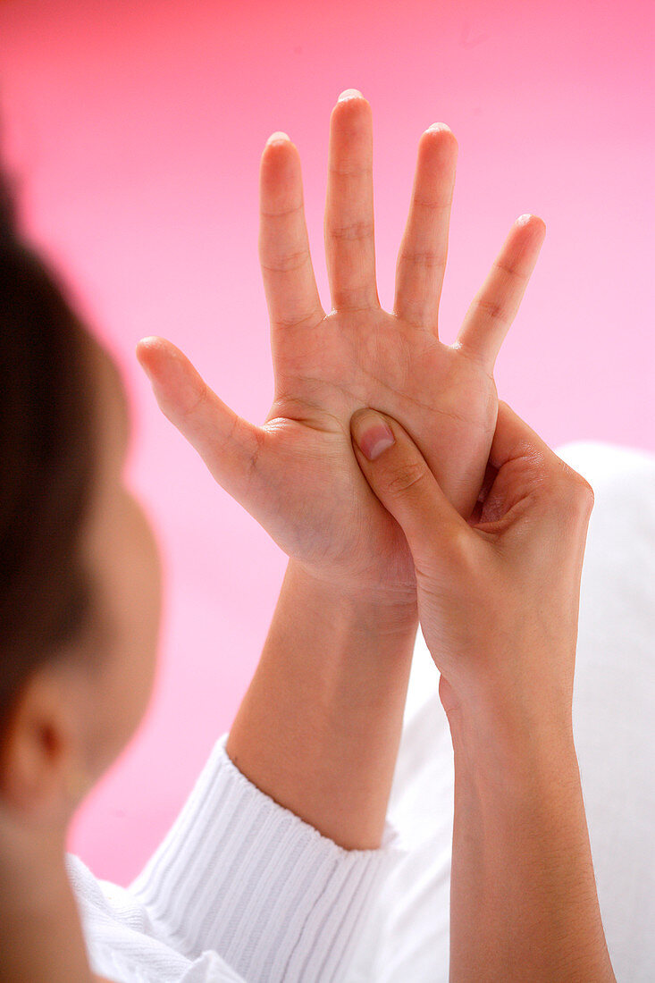 Woman massaging her hands