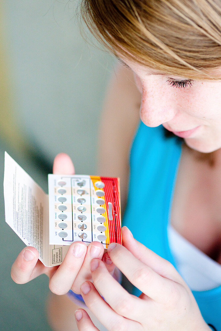 Girl with contraceptive pills