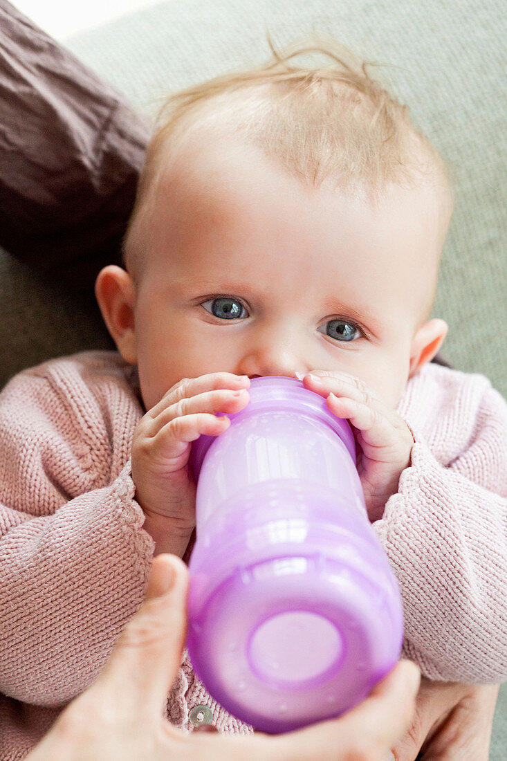 Baby with feeding bottle