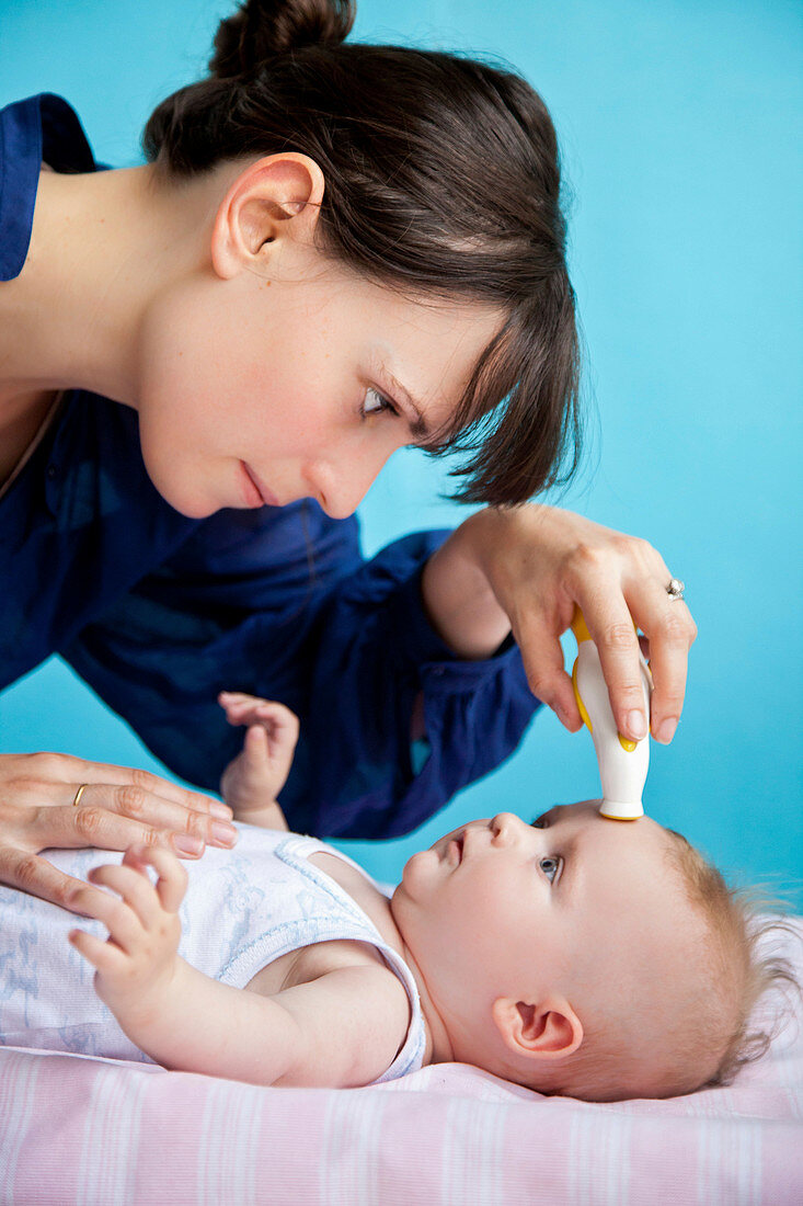 Checking baby's temperature