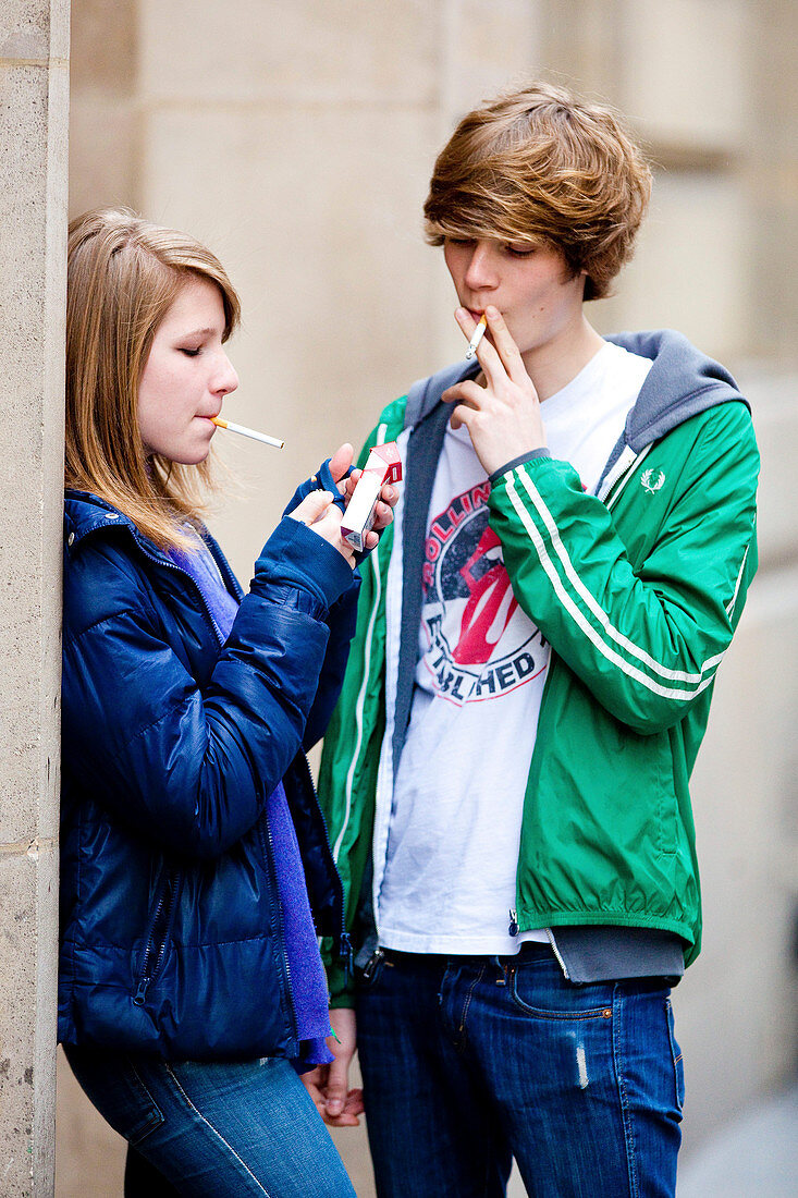 Teenagers smoking a cigarette