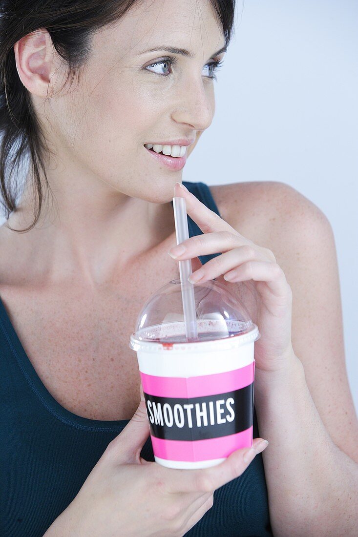 Woman drinking a smoothie