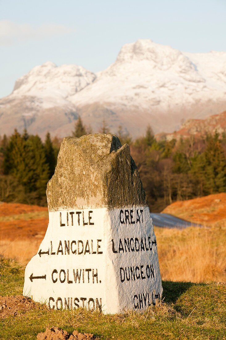 Old stone road sign in Langdale