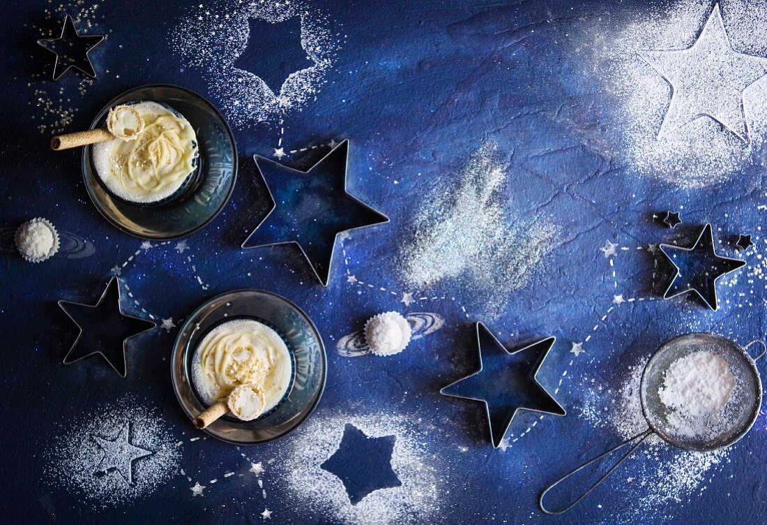 A milkshake with ground vanilla pods and the ice cream surrounded by star decorations